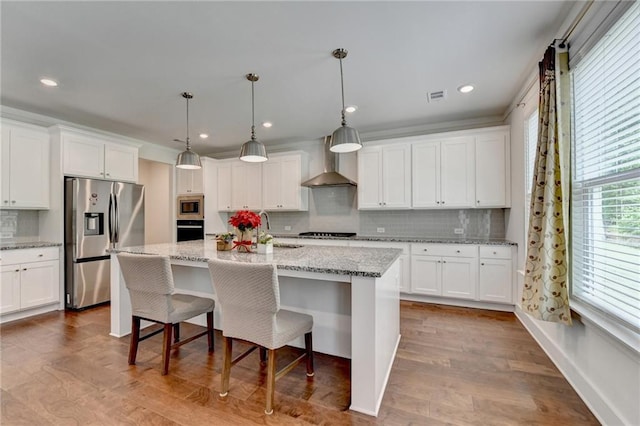8125 Beryl Overlook, Gainesville, GA 30506 - kitchen featuring dark wood finished floors, backsplash, appliances with stainless steel finishes, and wall chimney range hood