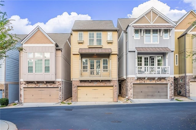 view of property featuring a garage and french doors