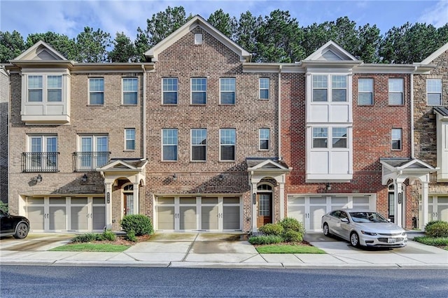 4232 Perimeter Park E Unit 110, Atlanta, GA 30341 - view of property with driveway, an attached garage, and brick siding
