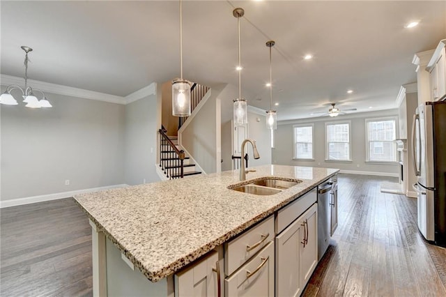 4232 Perimeter Park E Unit 110, Atlanta, GA 30341 - kitchen with open floor plan, appliances with stainless steel finishes, a center island with sink, dark wood-type flooring, and crown molding