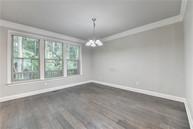 4232 Perimeter Park E Unit 110, Atlanta, GA 30341 - unfurnished room with crown molding, a chandelier, plenty of natural light, and dark wood-type flooring