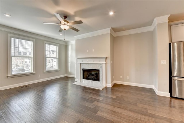 4232 Perimeter Park E Unit 110, Atlanta, GA 30341 - unfurnished living room featuring ornamental molding, ceiling fan, dark wood finished floors, a premium fireplace, and recessed lighting