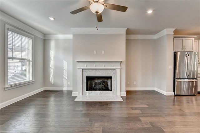 4232 Perimeter Park E Unit 110, Atlanta, GA 30341 - unfurnished living room featuring ornamental molding, a ceiling fan, recessed lighting, dark wood-style floors, and a high end fireplace