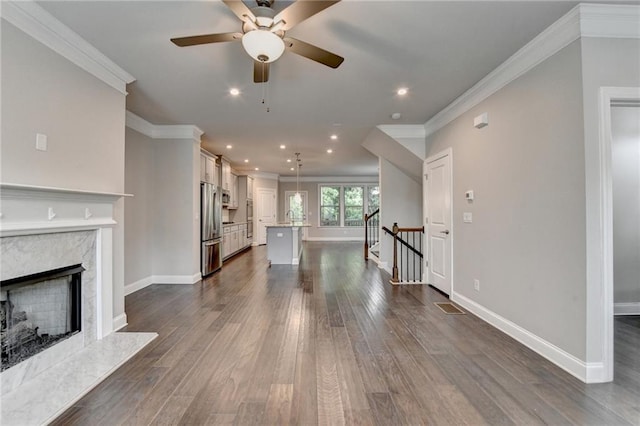 4232 Perimeter Park E Unit 110, Atlanta, GA 30341 - unfurnished living room with crown molding, dark wood-type flooring, recessed lighting, ceiling fan, and a premium fireplace