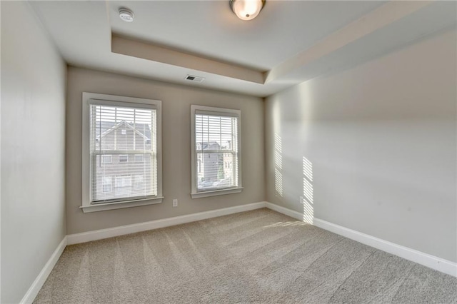 4232 Perimeter Park E Unit 110, Atlanta, GA 30341 - unfurnished room featuring carpet flooring, a smoke detector, and a raised ceiling