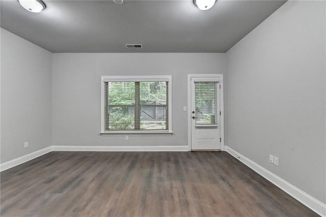 4232 Perimeter Park E Unit 110, Atlanta, GA 30341 - spare room with dark wood-type flooring and baseboards