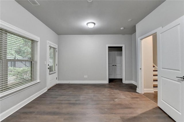 4232 Perimeter Park E Unit 110, Atlanta, GA 30341 - empty room with dark wood-style flooring and baseboards