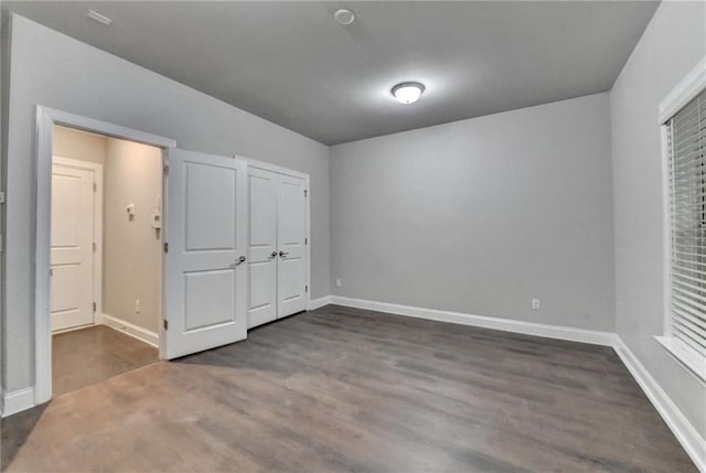4232 Perimeter Park E Unit 110, Atlanta, GA 30341 - unfurnished bedroom with dark wood-type flooring and baseboards