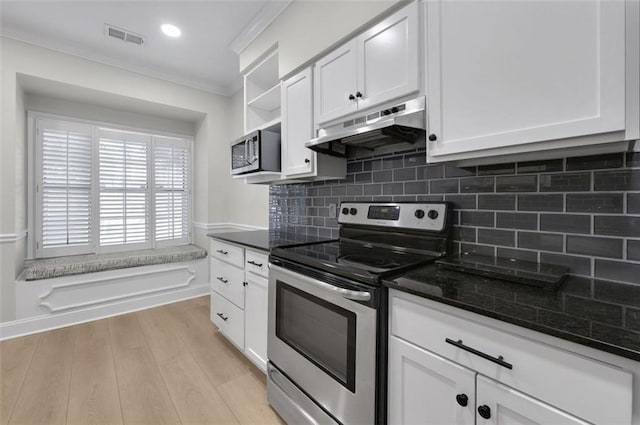 kitchen featuring stainless steel appliances, white cabinetry, and crown molding