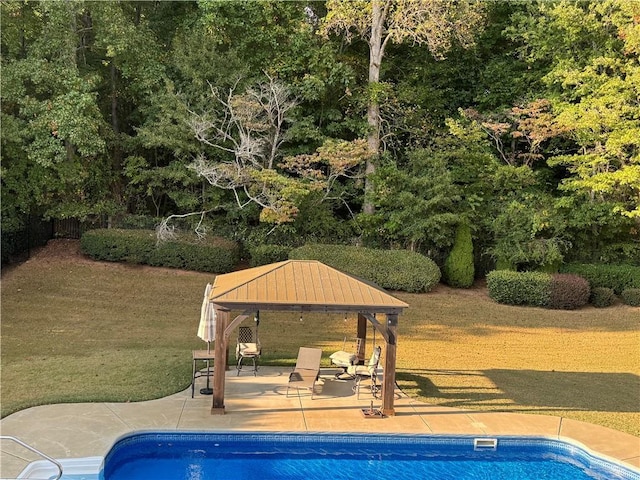 pool with a gazebo and a patio