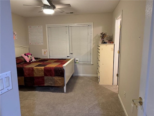 bedroom featuring carpet flooring, a ceiling fan, baseboards, and visible vents