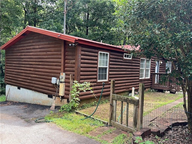 view of property exterior with crawl space