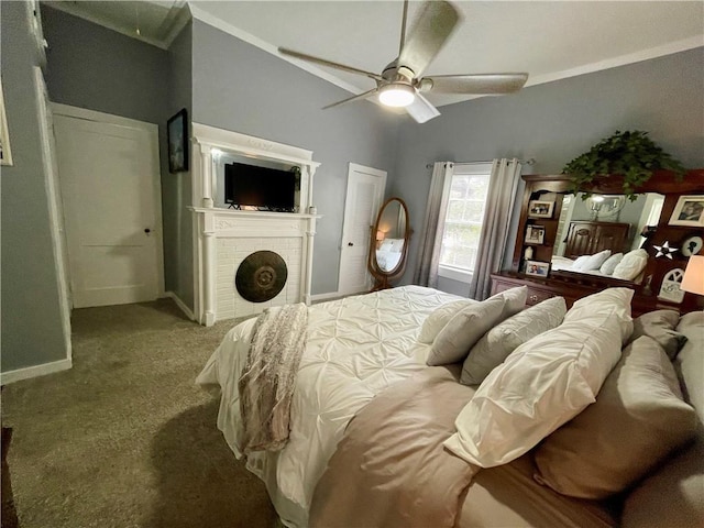 bedroom with a brick fireplace, lofted ceiling, ceiling fan, and carpet floors