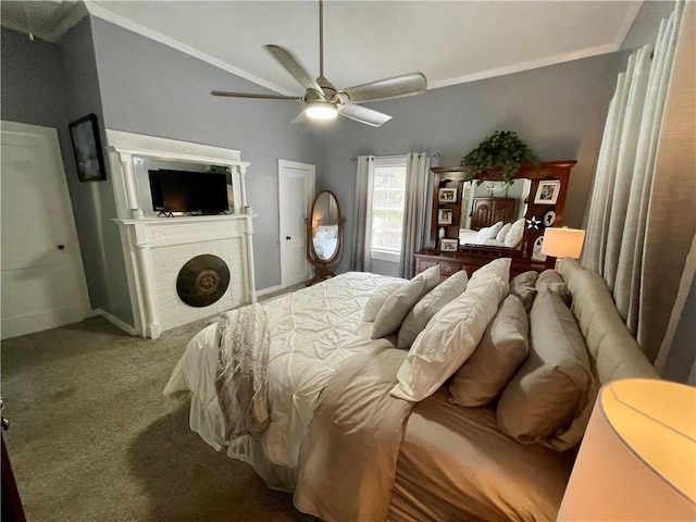 bedroom with carpet, ceiling fan, and a brick fireplace