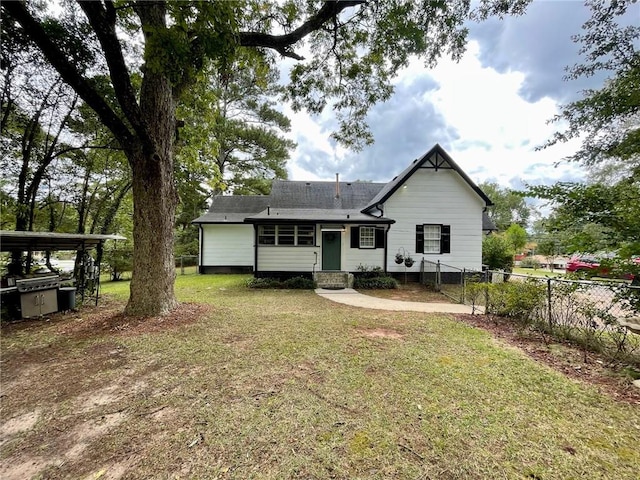 back of property featuring a lawn