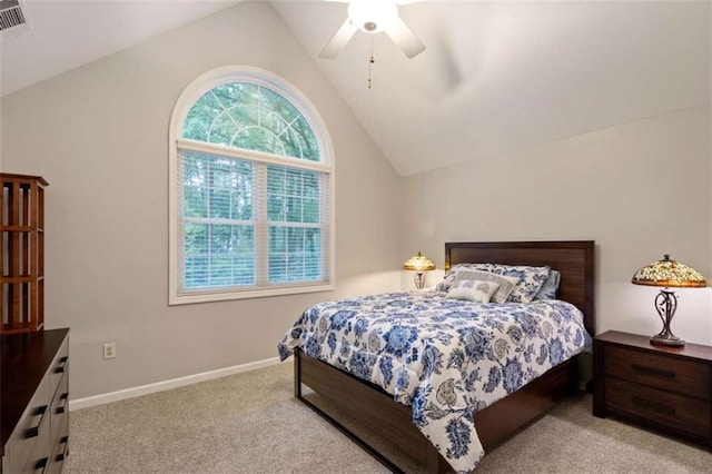 bedroom with lofted ceiling, carpet, baseboards, and a ceiling fan