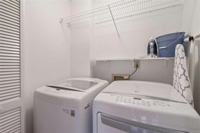 laundry area featuring laundry area and separate washer and dryer