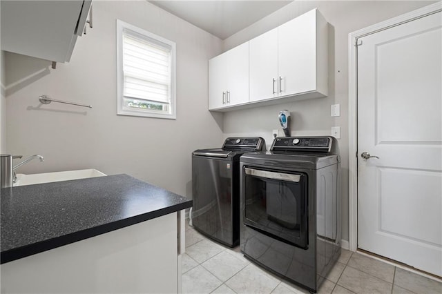 1998 Lakeview Bend Way, Buford, GA 30519 - laundry room with cabinet space, washing machine and dryer, and light tile patterned floors