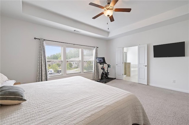 1998 Lakeview Bend Way, Buford, GA 30519 - carpeted bedroom featuring a raised ceiling, ensuite bath, and a ceiling fan