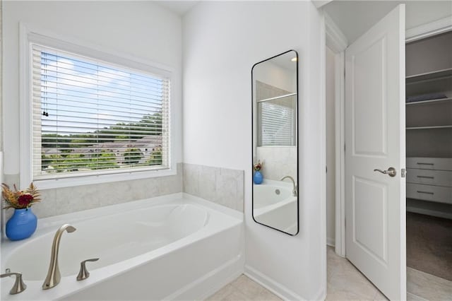 1998 Lakeview Bend Way, Buford, GA 30519 - bathroom featuring a bath, tile patterned flooring, and a shower