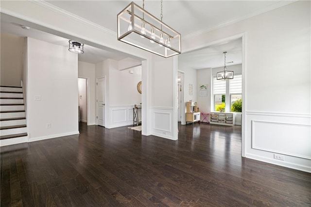 1998 Lakeview Bend Way, Buford, GA 30519 - unfurnished living room featuring a chandelier, wood finished floors, stairs, a decorative wall, and crown molding