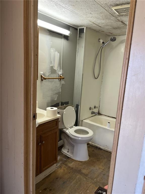 full bathroom with vanity, toilet, and  shower combination