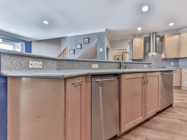 kitchen featuring light brown cabinets, ornamental molding, decorative backsplash, wall chimney exhaust hood, and light wood-type flooring