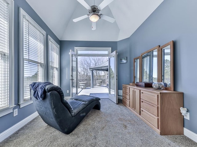 living area featuring high vaulted ceiling, carpet flooring, baseboards, and ceiling fan