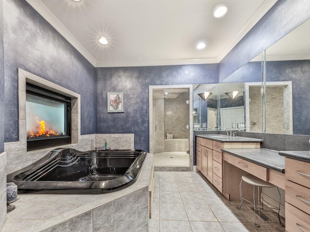 full bath featuring tile patterned floors, a garden tub, a stall shower, ornamental molding, and vanity