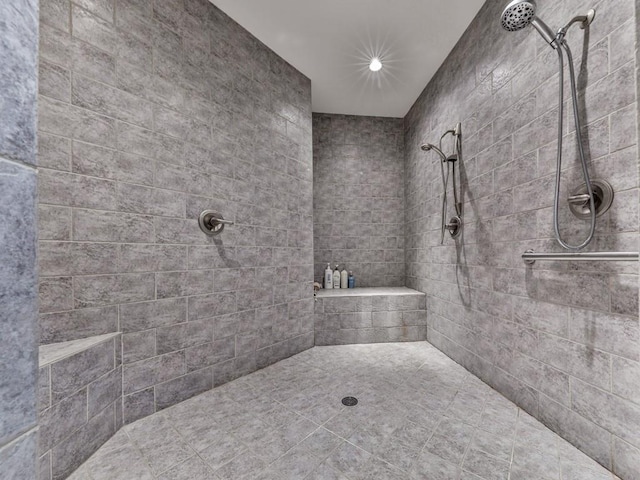 bathroom featuring a tile shower