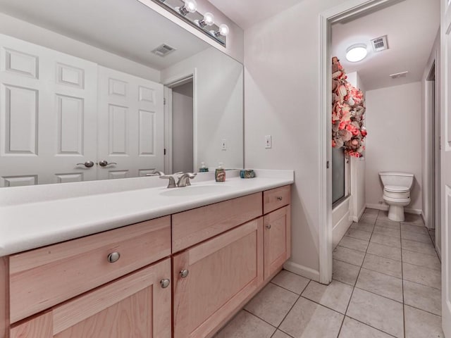 full bathroom with visible vents, toilet, tile patterned flooring, baseboards, and vanity