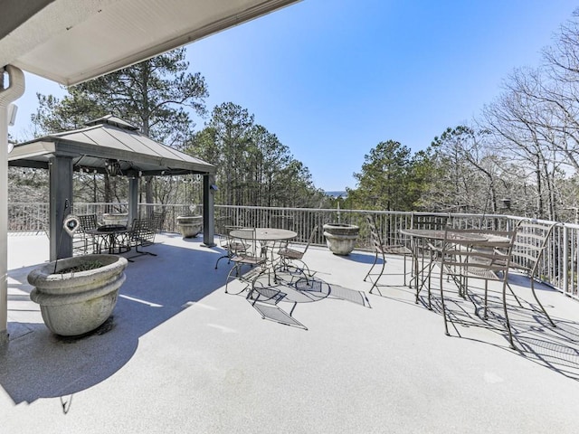 view of patio / terrace with a gazebo and outdoor dining area