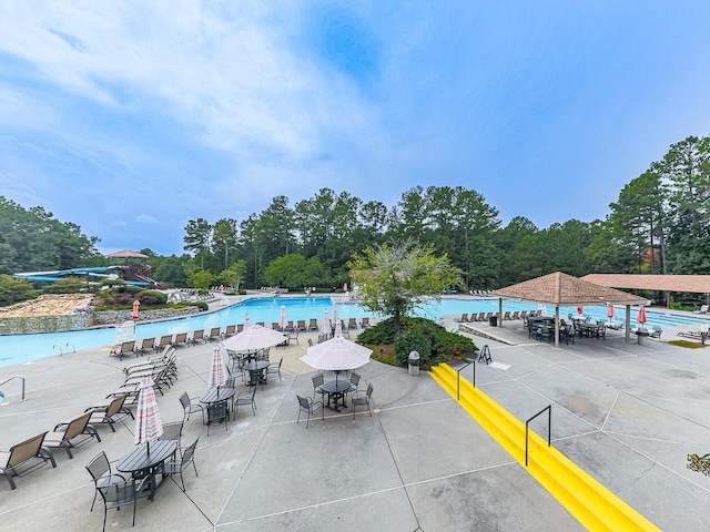 community pool with a patio area