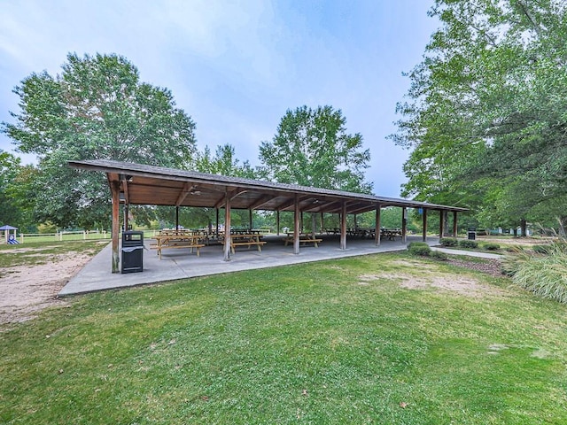 view of home's community featuring a yard and a patio area