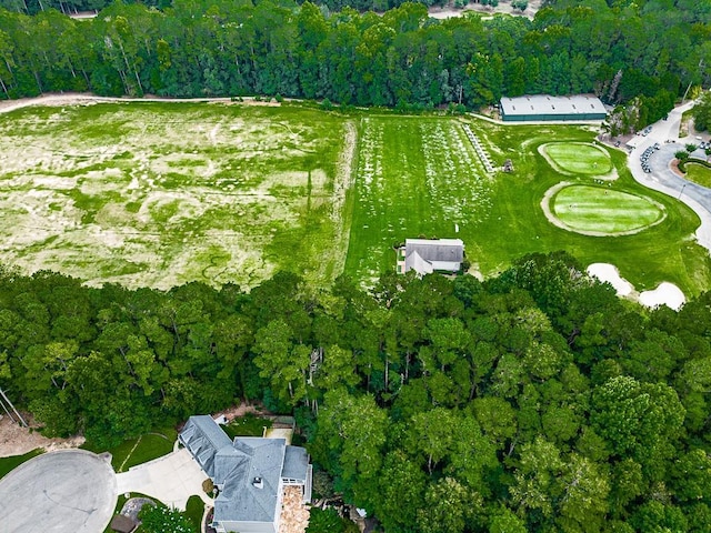 birds eye view of property featuring a forest view