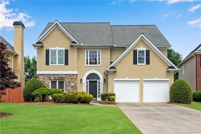 1712 Bonnabel Trce NE, Marietta, GA 30066 - traditional home featuring stucco siding, driveway, a front yard, a garage, and stone siding