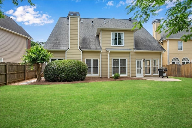 1712 Bonnabel Trce NE, Marietta, GA 30066 - back of house with a patio area, a chimney, and roof with shingles