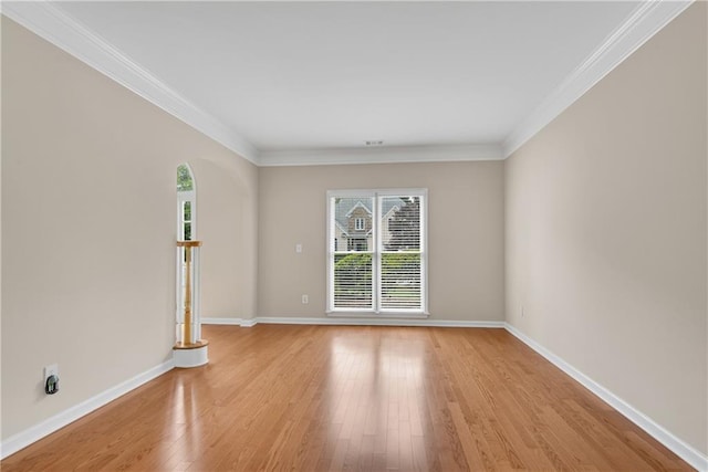 1712 Bonnabel Trce NE, Marietta, GA 30066 - spare room with plenty of natural light, light wood finished floors, baseboards, and ornamental molding
