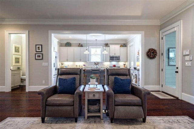 living room featuring hardwood / wood-style floors and crown molding