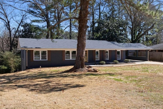 ranch-style house with a front lawn