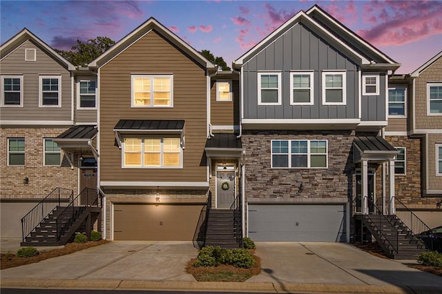 2517 Hedgeway Cir, Kennesaw, GA 30144 - townhome / multi-family property with an attached garage, board and batten siding, and concrete driveway