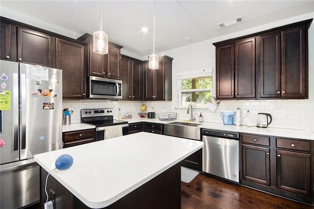2517 Hedgeway Cir, Kennesaw, GA 30144 - kitchen with appliances with stainless steel finishes, a sink, dark wood-type flooring, dark brown cabinets, and light countertops