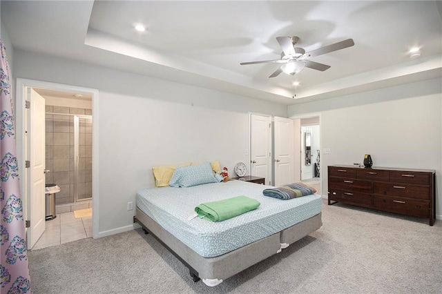 2517 Hedgeway Cir, Kennesaw, GA 30144 - bedroom featuring carpet flooring, a tray ceiling, connected bathroom, baseboards, and ceiling fan