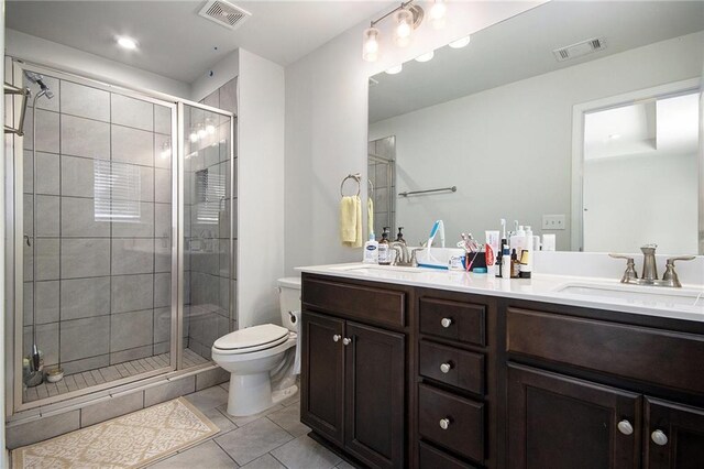 2517 Hedgeway Cir, Kennesaw, GA 30144 - full bath with double vanity, toilet, a stall shower, and tile patterned floors