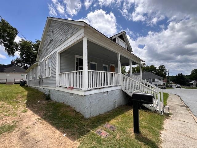 6 Hazel St, Porterdale, GA 30014 - view of property exterior with a porch