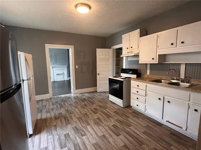 6 Hazel St, Porterdale, GA 30014 - kitchen featuring electric range, under cabinet range hood, white cabinetry, dark wood-style floors, and a textured ceiling