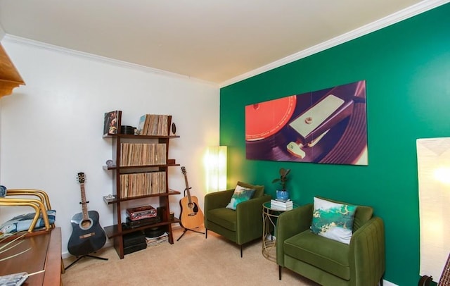sitting room with carpet and ornamental molding