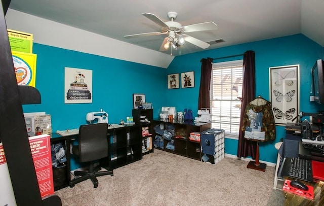 carpeted office space with baseboards, visible vents, ceiling fan, and lofted ceiling