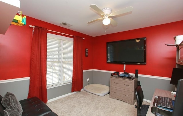 office with baseboards, visible vents, a ceiling fan, and carpet floors