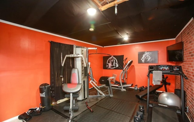 exercise area featuring brick wall